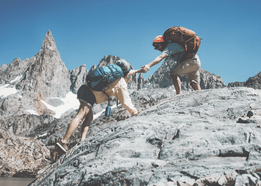 Two people mountain climbing