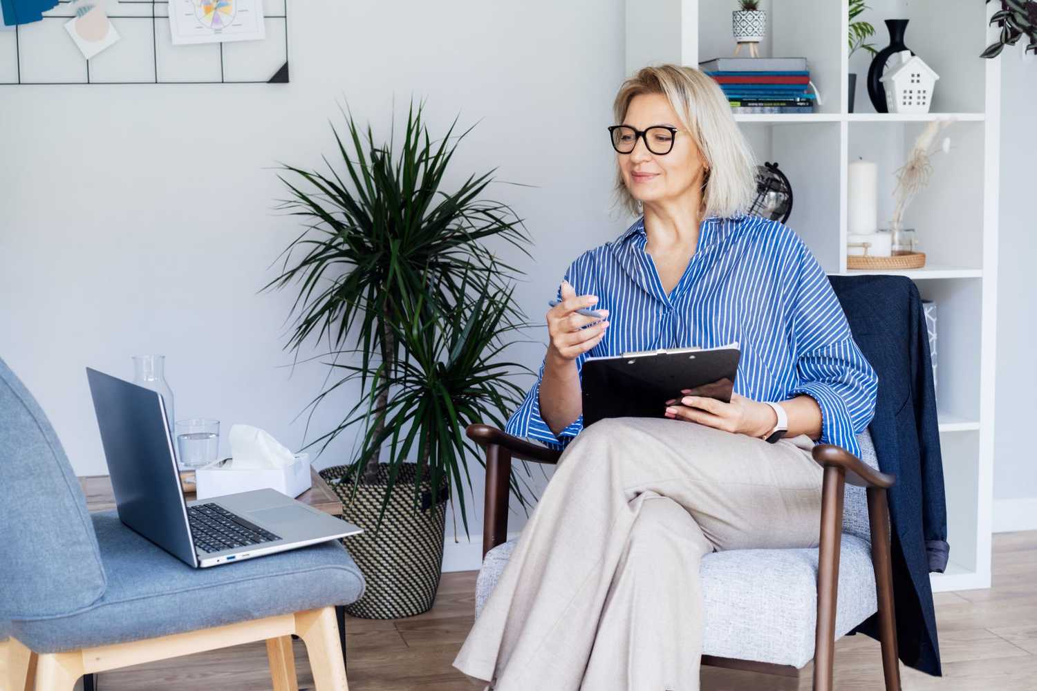 Behavioral health clinician conducting a telehealth consultation to help identify psychosocial barriers and support workers' compensation recovery.